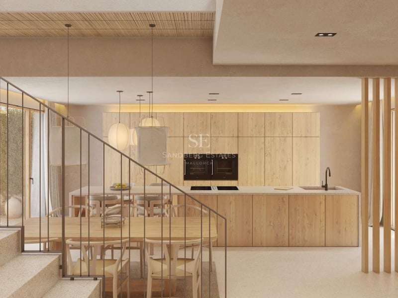 Cuisine moderne avec îlot en bois, salle à manger avec chaises Wishbone et escalier en pierre minimaliste.