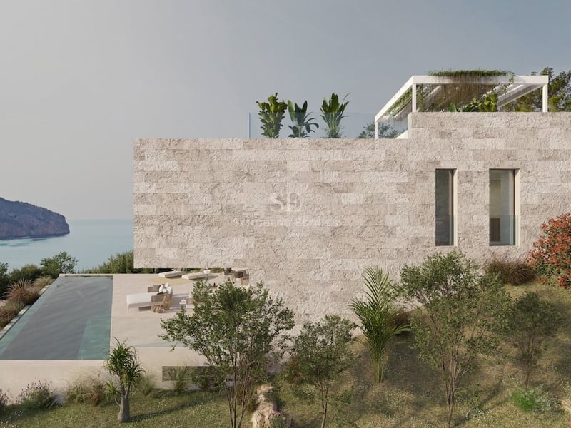 Villa moderne en pierre avec piscine à débordement face à la mer et jardin méditerranéen.