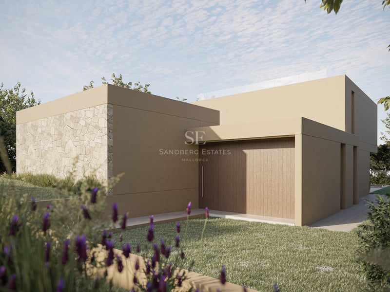 Extérieur de villa contemporaine avec mur en pierre naturelle, enduit sable et porte en bois près du gazon.