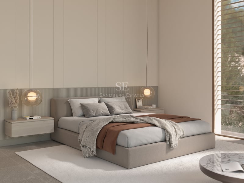 Chambre principale minimaliste avec un grand lit, des tables de nuit flottantes et des suspensions sphériques.