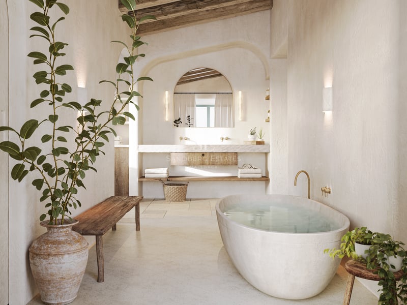Salle de bains de luxe rustique avec baignoire îlot blanche, vanité en pierre, poutres en bois et arches.