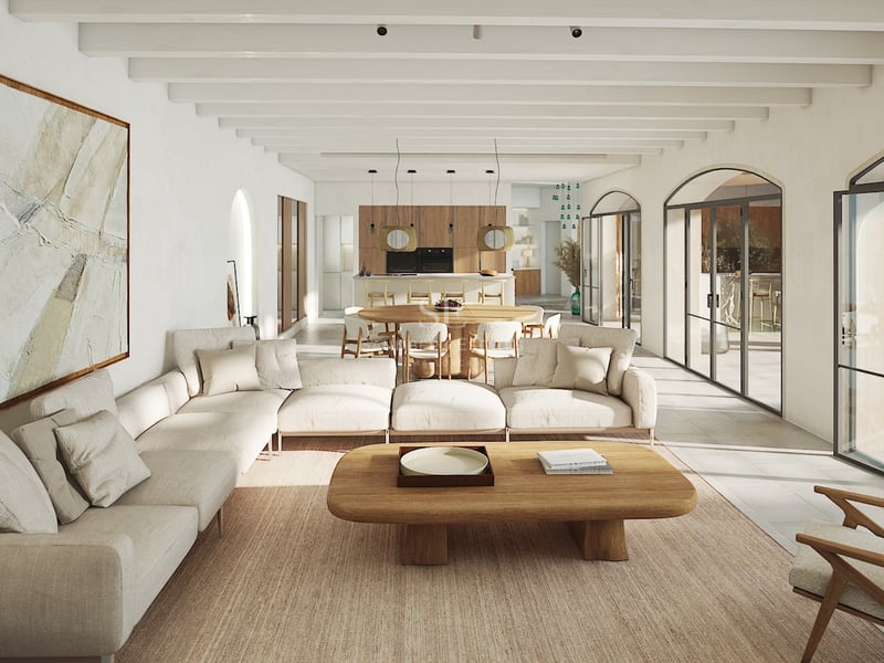 Salón moderno con techos de vigas blancas, grandes puertas arqueadas de cristal y muebles de madera clara.