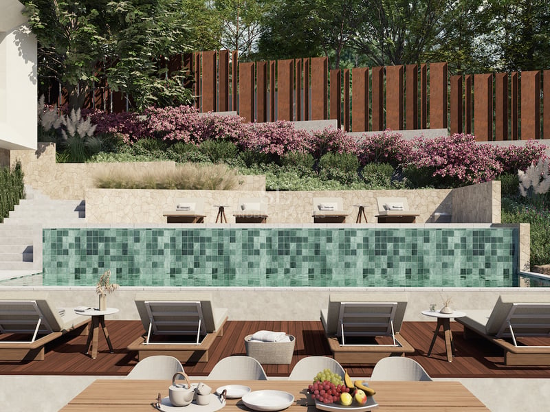 Piscine de luxe avec bains de soleil, terrasse en bois, murs en pierre naturelle et jardins paysagers en restanques.