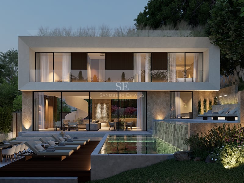 Villa contemporaine de luxe sur deux étages au crépuscule avec piscine à débordement éclairée et balcon en verre.