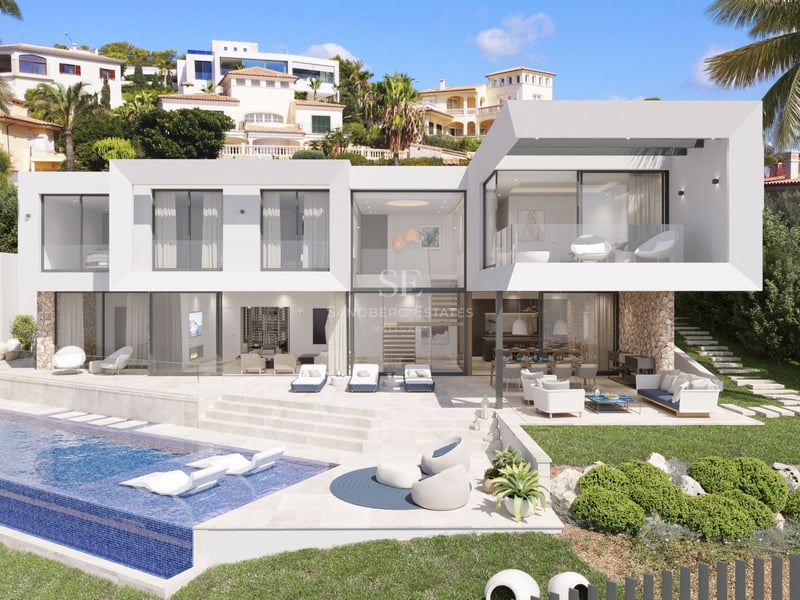 Vue extérieure d'une villa de luxe blanche avec piscine à débordement et terrasse en pierre naturelle.