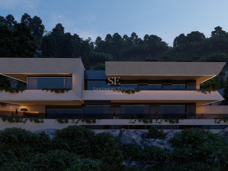 Vue au crépuscule d'une villa contemporaine à plusieurs niveaux avec balcons en porte-à-faux et éclairage LED linéaire.