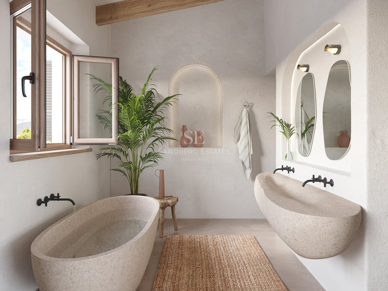 Baignoire et lavabo en pierre sculptée dans une salle de bain avec poutres en bois et murs en plâtre.