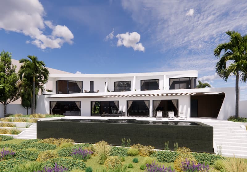Villa de Luxe Moderne avec Piscine à Débordement Villa blanche à deux étages, architecture courbe, piscine à débordement en carrelage sombre et jardin paysager.