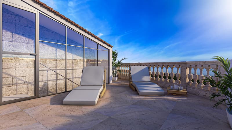 Terrasse sur le toit avec deux chaises longues modernes, sol en pierre naturelle et balustrade classique sous ciel bleu.