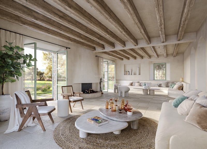 Vaste salon méditerranéen avec poutres en bois, sol en pierre, tables en marbre et vue sur le jardin.