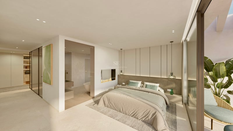Chambre de maître lumineuse et moderne avec cheminée intégrée, salle de bain vitrée et baies vitrées.