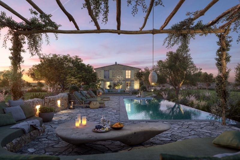 Villa de luxe avec piscine, pergola en bois et terrasse en pierre naturelle au coucher du soleil à Majorque.
