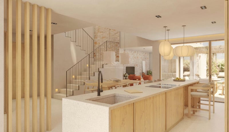 Îlot de cuisine moderne avec évier en pierre et finitions en bois, intégré à la salle à manger et à l'escalier.