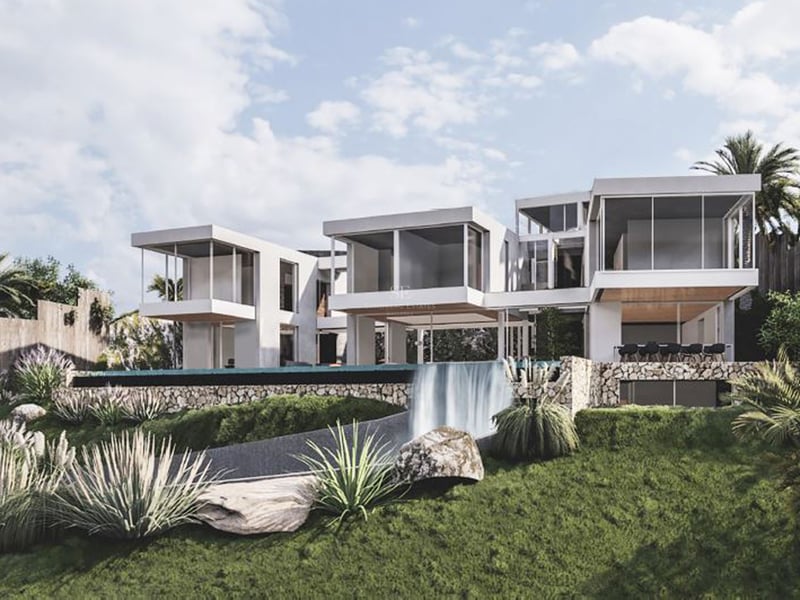 Villa blanche moderne avec pièces en porte-à-faux et piscine à débordement avec cascade sur un jardin paysager.
