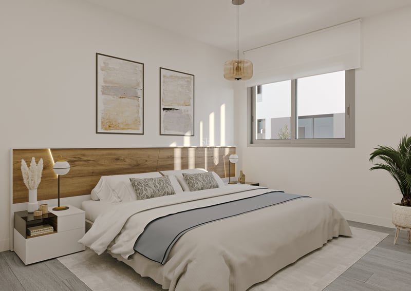 Dormitorio principal moderno con cabecero de madera integrado, ventana grande, ropa de cama neutra y planta de interior.