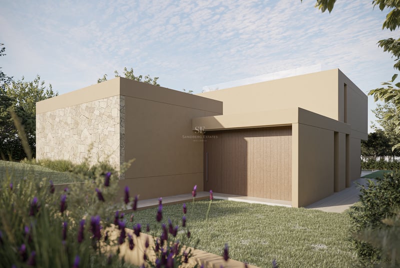 Extérieur de villa contemporaine avec mur en pierre naturelle, enduit sable et porte en bois près du gazon.