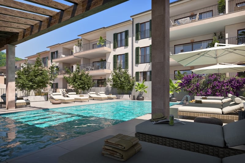 Turkos pool med designade solstolar, bougainvillea och modern medelhavsbyggnad under en blå himmel.