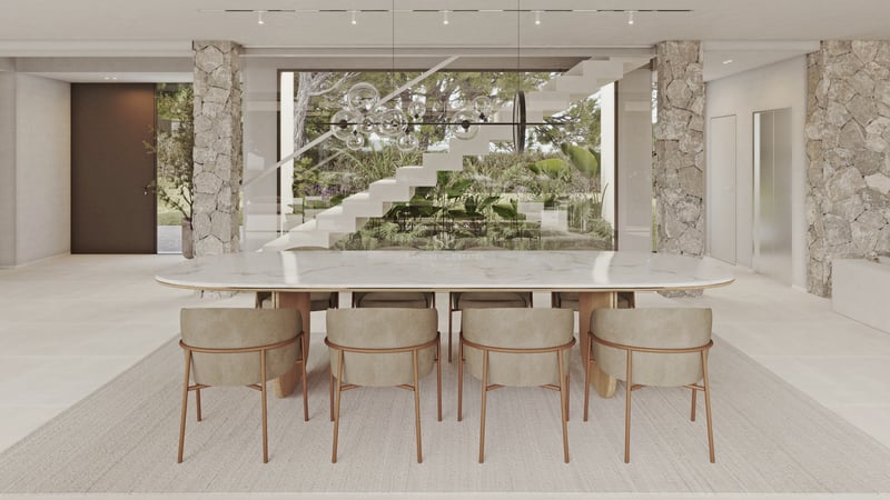 Salle à manger élégante avec table en marbre blanc, piliers en pierre et vue sur un escalier design et jardin luxuriant.