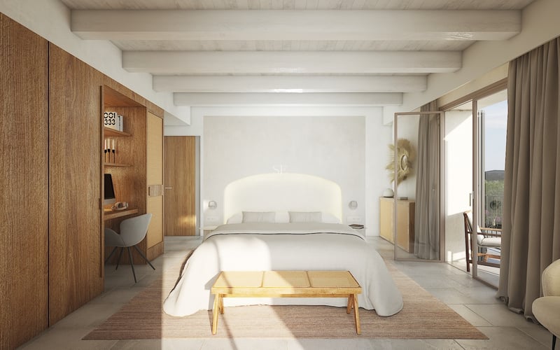 Dormitorio luminoso con vigas blancas, armarios de madera con escritorio, cama amplia y acceso al balcón.